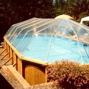 A fabric sun dome cover over the pool