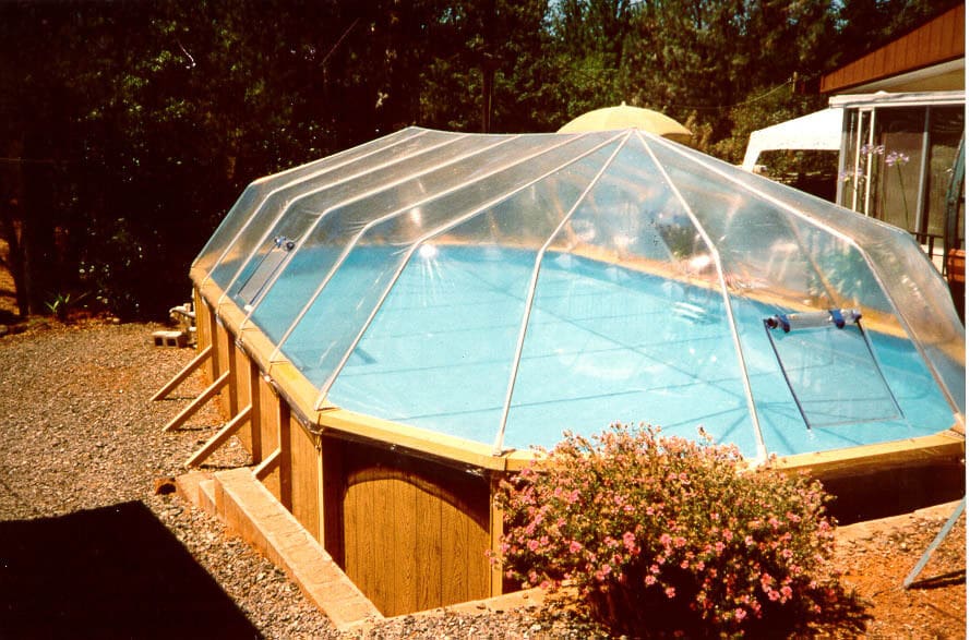 A fabric sun dome cover over the pool