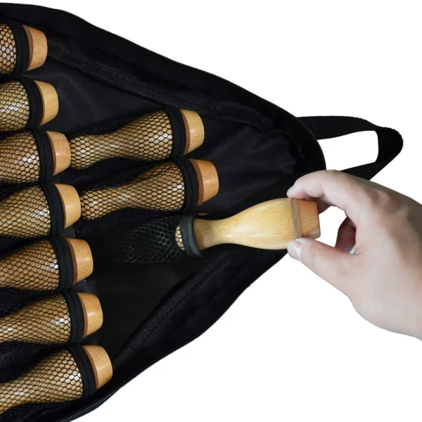 A person is holding a bag full of Shuffleboard Bowling Pin Set.