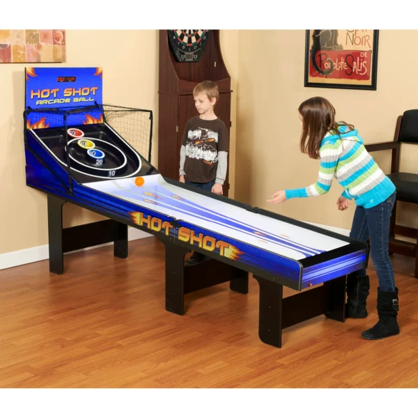 A boy and a girl playing a game of Hot Shot 8-ft Roll Hop and Score Arcade Game Table with LED Scoring.