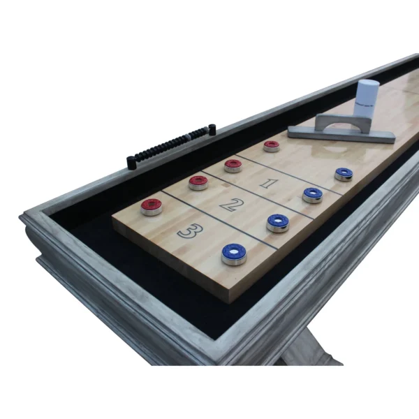 A Montecito 12-ft Shuffleboard Table - Driftwood Finish with a set of blue and red buttons.