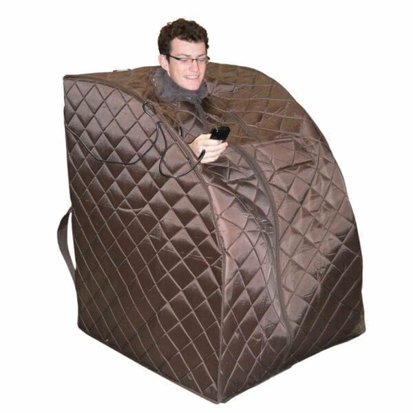 A Man Sitting in a Harmony Deluxe Oversized Portable Sauna