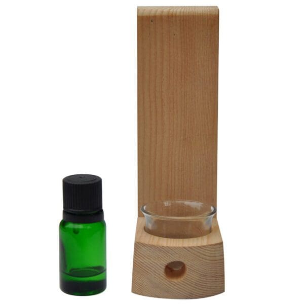 A Sauna Aromatherapy Kit with a bottle of essential oil next to it.