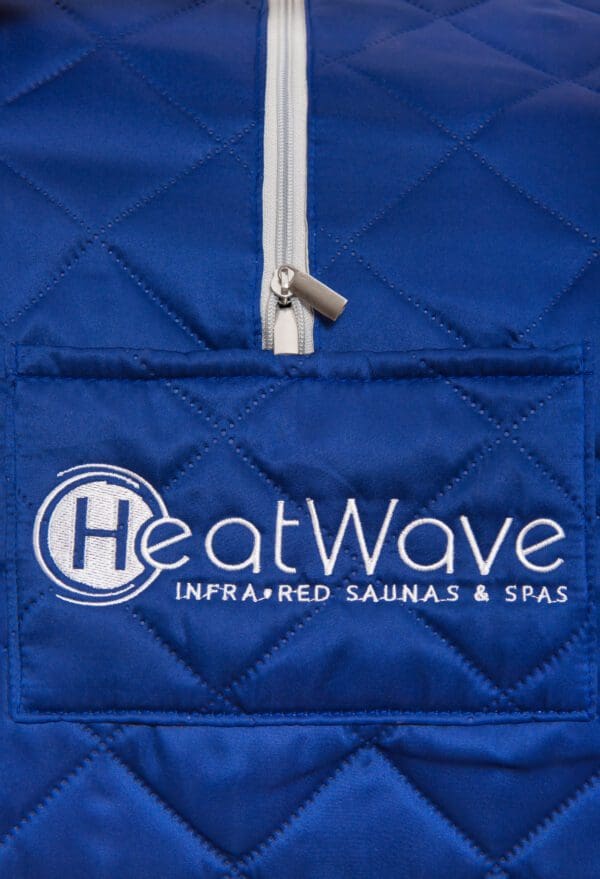 A blue quilted Liberty Portable Sauna bag with the heatwave logo on it.