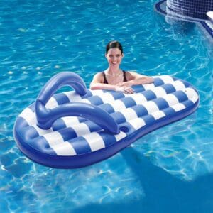 Smiling woman on striped inflatable pool float